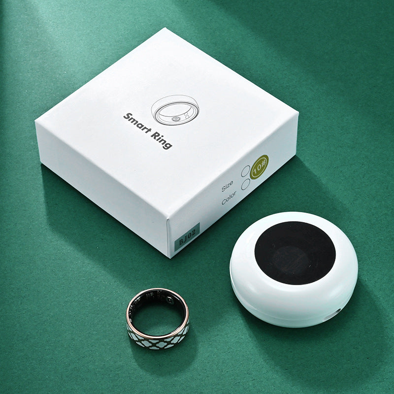 Health Smart Titanium Steel Ring Waterproof Blood Pressure next to its packaging on a green background.